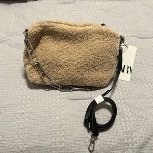 Sherpa crossbody bag with black leather strap and silver chain